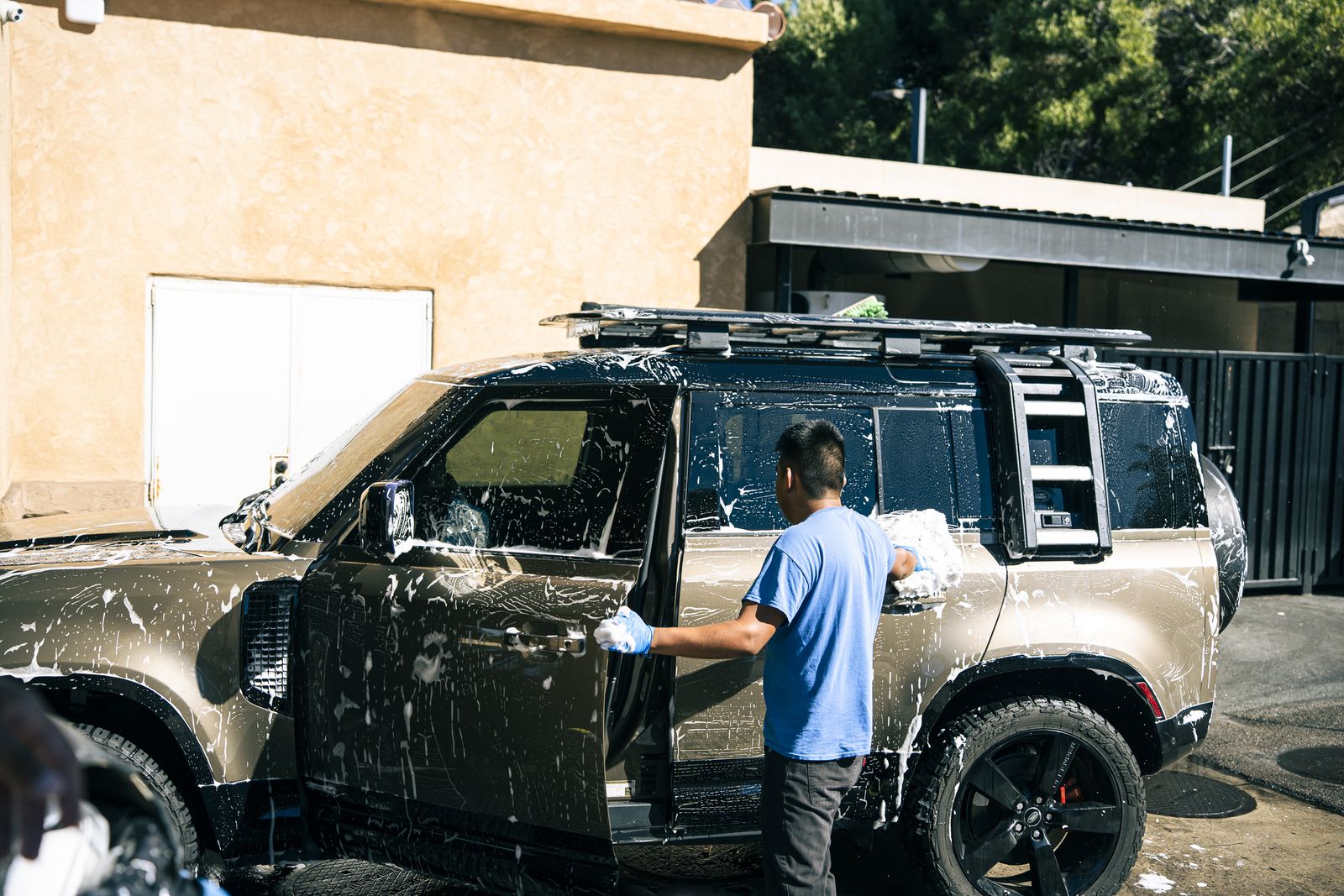A Land Rover Defender covered in hand-applied foam