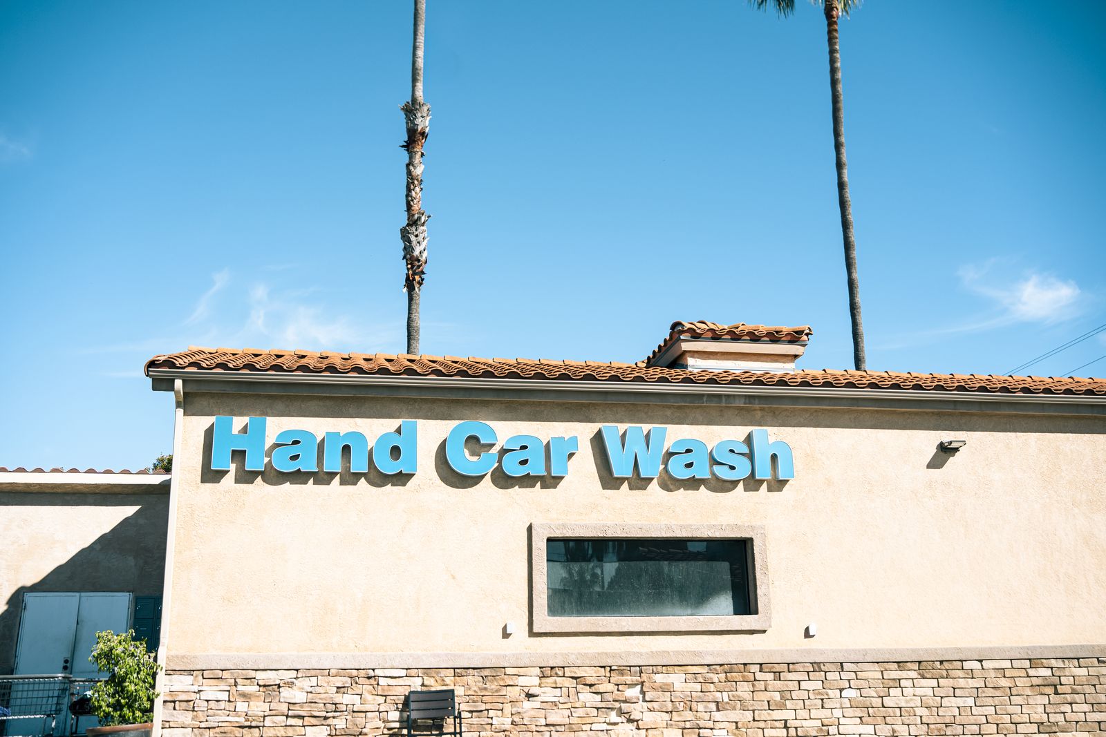 The Cardiff Hand Car Wash storefront sign on Birmingham Drive
